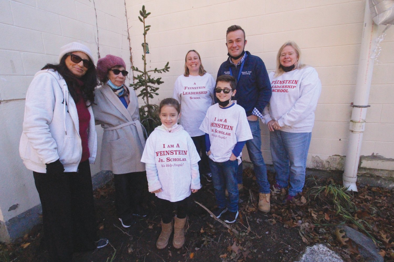 A SPECIAL PLACE: Leila Feinstein and her mother Dr. Pat Feinstein are joined by those who participated in the memorial tree ceremony, Eva Lesuer, Alex Gemma, Dana Scolano, Principal Frank Galligan and Cathy Maguire.